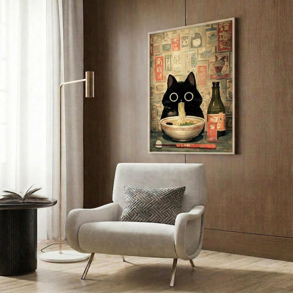 May include: Framed poster print featuring a black cat with wide white eyes sitting behind a bowl of ramen noodles, surrounded by vintage Japanese advertisements and bottles. The artwork is displayed on a wood-paneled wall above a cream-colored modern armchair with geometric throw pillow. A gold floor lamp and side table with open book complete the contemporary living room setting with neutral tones and natural lighting from nearby window.