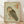 May include: Framed vintage-style Japanese woodblock print of a brown and tan owl with large dark eyes, featuring traditional calligraphy characters in red seals, displayed against white walls on light wooden floors in natural lighting