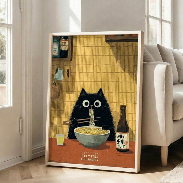 May include: Large framed poster print leaning against white wall next to beige sofa. Artwork shows black fluffy cat with wide eyes eating ramen noodles with chopsticks at orange table. Japanese-style kitchen background with bamboo mat walls, sake bottles, and traditional items. Text reads "RELYSTES FULL ENERGY" at bottom. Warm yellow and orange color palette with vintage illustration style.