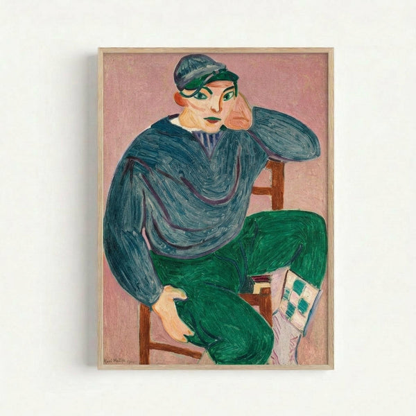 A Fauve-style portrait painting showing a seated figure in a wooden chair, wearing a blue-green cap and sweater with bright green pants. The person rests their chin on their hand in a contemplative pose against a pink background. The artwork features bold, expressive brushstrokes and vibrant colors characteristic of early 20th century modernist painting. A small checkerboard pattern appears near the bottom right. The piece is displayed in a light wooden frame against a white wall.