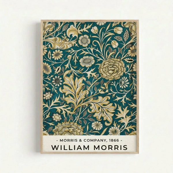 Ornate botanical pattern poster with golden flowers, leaves, and intricate floral motifs on deep teal background. Features detailed chrysanthemums, daisies, and flowing vine designs in cream and gold tones. Text at bottom reads "Morris & Company, 1866" and "William Morris" in black letters on white background. Displayed in thin natural wood frame against white wall.