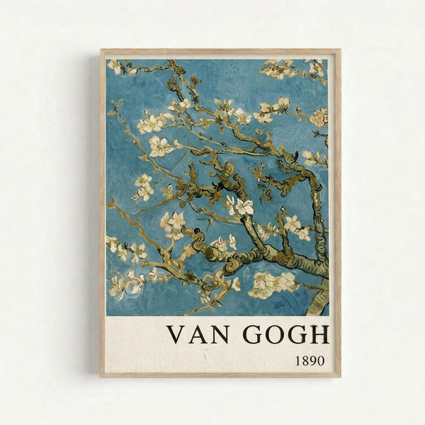 Framed reproduction of Van Gogh's almond blossom painting showing delicate white flowering branches against a turquoise blue sky. The artwork features the artist's characteristic swirling brushstrokes and is displayed in a light wooden frame. Below the image is white text reading "VAN GOGH 1890" on a cream background. The poster hangs on a white wall.