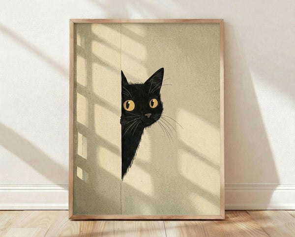 May include: Framed poster print displaying a black cat with bright yellow eyes peeking around what appears to be a corner or doorway. The artwork features a vintage-style beige and cream colored background with geometric shadows. The cat's face shows detailed whiskers and alert expression. Natural wood frame sits on light wooden flooring against white wall with natural sunlight creating diagonal shadow patterns across the scene.
