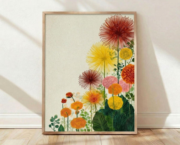 May include: Framed botanical poster print leaning against white wall on light wood floor. Features stylized sunburst flowers in vibrant yellow, orange, pink and red with radiating petal patterns, alongside green foliage on cream background. Natural wood frame, soft lighting creates gentle shadows on textured white wall.