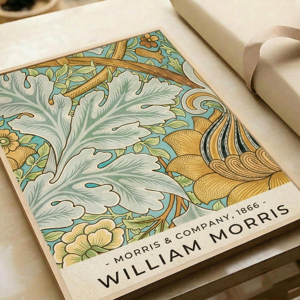 Decorative botanical print featuring intricate William Morris-style design with flowing acanthus leaves in sage green, golden yellow flowers, and ornate curved stems on a turquoise background. The vintage-inspired artwork displays fine line work and organic Art Nouveau patterns. Print shown flat on white paper with cream ribbon visible at edge, demonstrating the poster's size and paper texture.