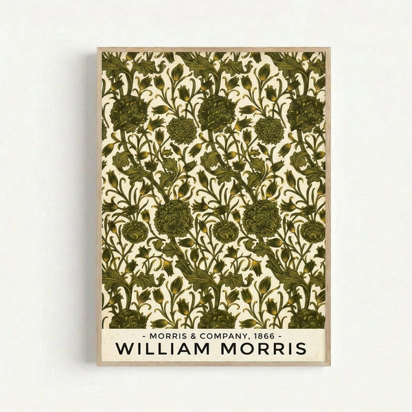 Framed botanical art print featuring an intricate repeating pattern of olive green flowers and flowing vines on cream background. The design shows detailed thistle-like blooms with ornate leaves in Victorian decorative style. Text at bottom reads "Morris & Company, 1866 - William Morris" in black letters. Natural wood frame against white wall.
