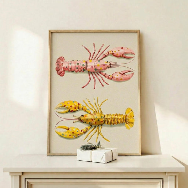 May include: Framed marine illustration print featuring two colorful lobsters with polka dot patterns - one pink with multicolored spots and one yellow with red spots - displayed on a light wood shelf against a cream wall. Small white wrapped gift box with evergreen sprig sits nearby. Natural wood frame surrounds the vintage-style scientific illustration on cream background.