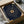 May include: Navy blue poster with golden vinyl record design and personalized song lyrics arranged in circular text pattern around the record. Framed artwork sits in wooden gift box with tissue paper, displayed next to decorative glass vessel on neutral surface. Elegant presentation suggests premium quality print with metallic accents.