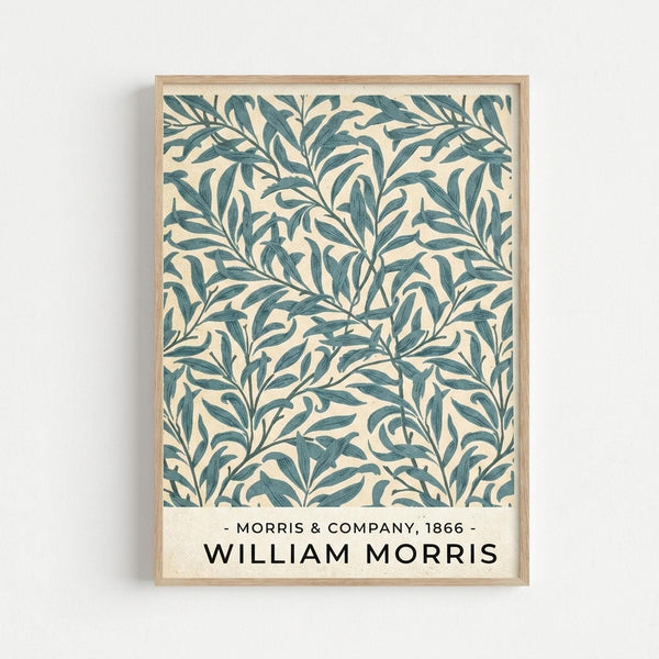 A framed botanical poster featuring an intricate repeating pattern of intertwining willow branches and leaves in teal green on a cream background. The vintage-style design shows flowing, organic foliage with delicate line work characteristic of Arts and Crafts movement aesthetics. Text at the bottom reads "Morris & Company, 1866" and "William Morris" in black lettering. The artwork is displayed in a light wood frame against a white wall.