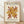 May include: Framed poster with cream background featuring abstract cut-out design in golden yellow and rust red organic shapes resembling coral or seaweed. Black text reads "MATISSE THE CUT-OUTS" at top and "BERGGRUEN & CIE" with Paris gallery information and 1953 exhibition dates below. Light wood frame sits on wooden floor against white wall with soft natural lighting and fabric shadows.