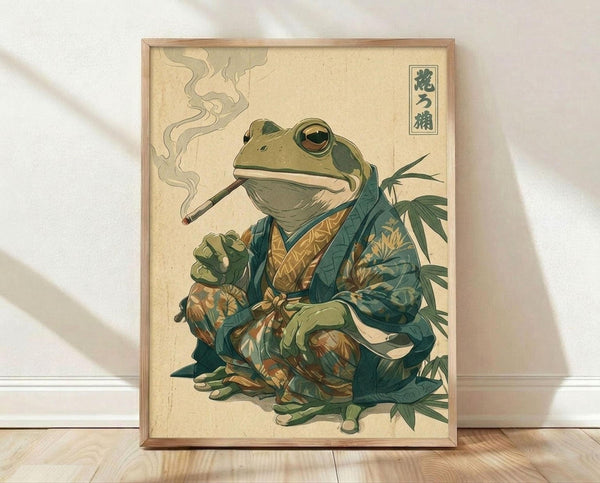 May include: Framed poster print leaning against white wall on light wood floor. Artwork shows anthropomorphic frog in traditional Japanese style wearing ornate teal and gold patterned kimono, smoking long pipe with wisps of smoke curling upward. Frog sits among green foliage with Japanese characters in upper right corner. Aged cream background gives vintage woodblock print appearance. Natural wood frame surrounds the piece.