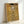 May include: Framed reproduction of Gustav Klimt's golden portrait painting showing an elegant woman in ornate dress against decorative patterned background. The artwork features rich gold tones, geometric and spiral motifs, and Art Nouveau styling. Simple light wood frame displayed leaning against white wall on white surface, showing the print's warm metallic colors and intricate details.