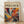 The image is a framed poster with a vibrant abstract painting on the cover.