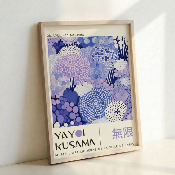 A framed poster advertising an art exhibition titled "Yayoi Kusama" at the Musée d'Art Moderne de la Ville de Paris, dated April 28, 1984.
