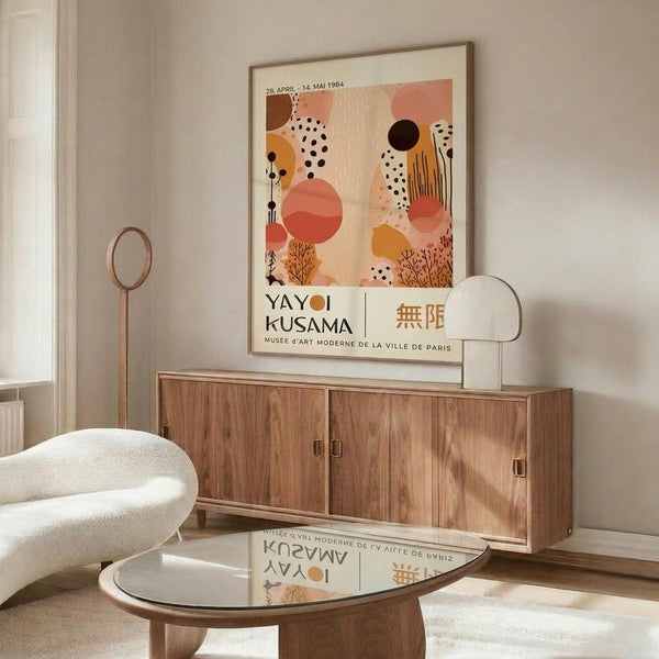 a modern living room with a large abstract art poster on the wall, a wooden cabinet, a white sofa, and a glass coffee table.