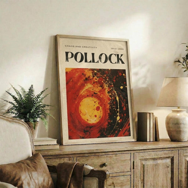 a framed poster of Pollock's artwork displayed on a wooden cabinet in a living room setting.