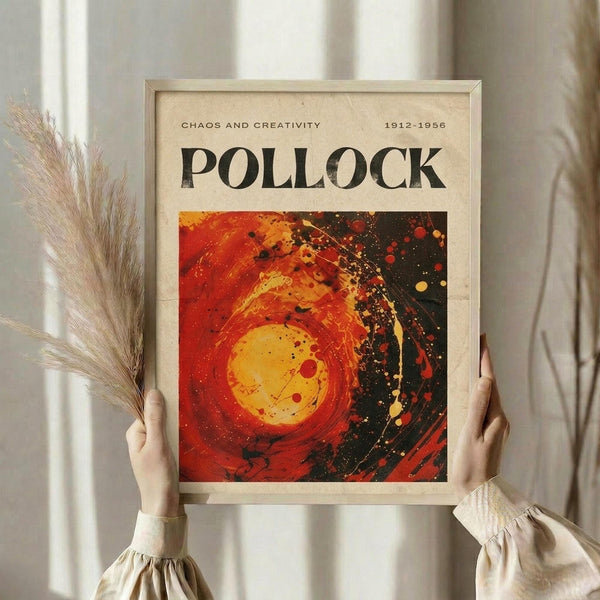 A person's hands holding a framed poster with the title "POLLOCK" and an abstract painting with a red and orange color scheme.