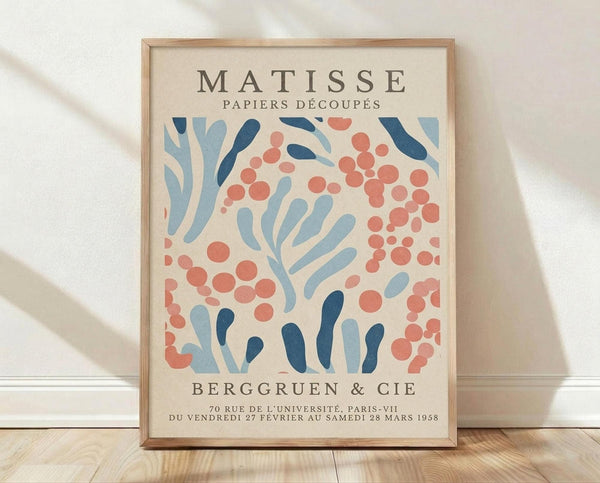 The image is a poster for the Matisse exhibition, featuring a colorful abstract design with various shapes and patterns.
