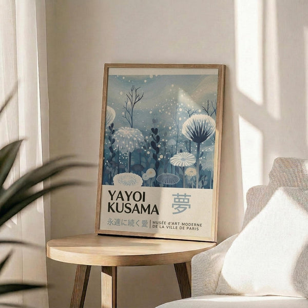A framed poster of a floral design hangs on a wall, with the text "YAYOI KUSAMA" and "MUSEUM DE LA VILLE DE PARIS" below it.