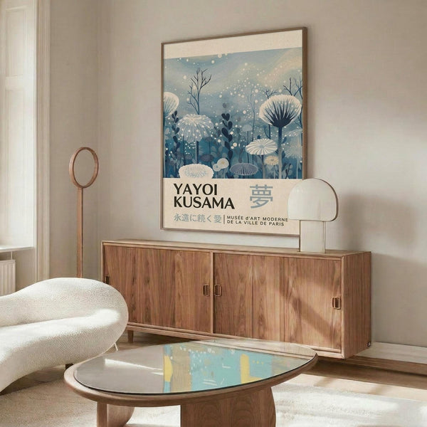 a living room with a large poster of a floral design on the wall, a wooden cabinet, a white sofa, and a glass coffee table.