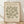 The image is a framed poster featuring a repeating pattern of green leaf-like shapes, with text providing information about the artwork.
