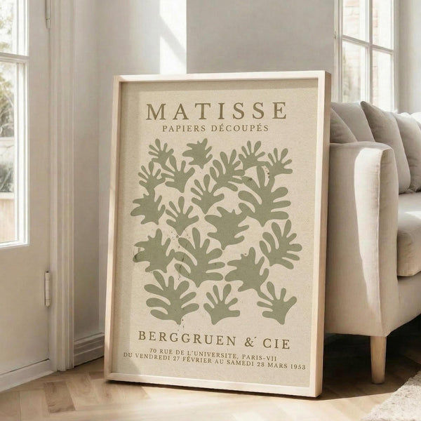 a framed poster of the famous painting "Matsisse" by the artist Bergsten & Cie, which depicts a large number of stylized green leaves.