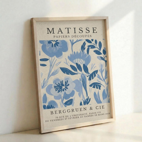 The image is a framed poster featuring a blue floral pattern with the text "MATISSE Papiers Decoupes" and "BERGGRUEN & CIE" printed on it.