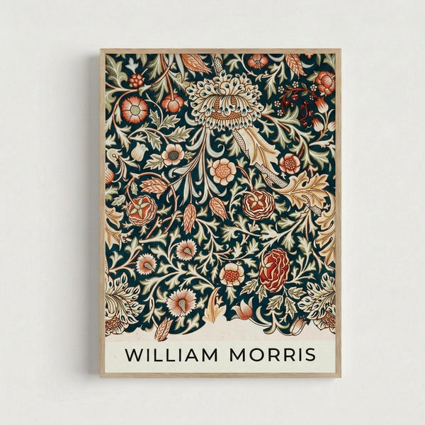 May include: Framed botanical art print featuring William Morris's intricate floral pattern on dark teal background with coral, cream and gold flowers, leaves and ornate scrollwork. Natural wood frame mounted on white wall. Victorian-style decorative design with roses, chrysanthemums and flowing foliage creating dense, symmetrical pattern. Artist name displayed in black text at bottom.