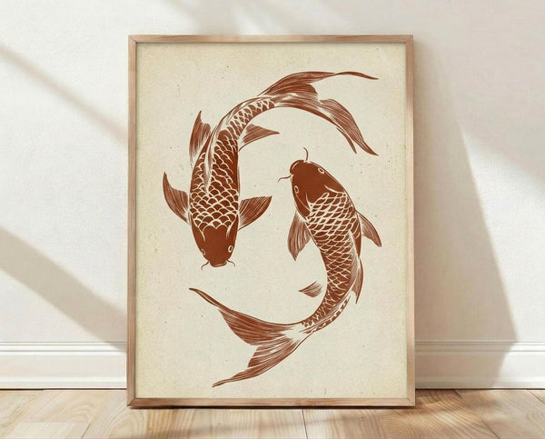 May include: Framed art print showing two brown koi fish swimming in a circular yin yang pattern on cream textured paper background. The fish feature detailed scales and flowing fins in warm rust-brown tones. Natural wood frame sits against white wall with soft shadows on light wooden floor.