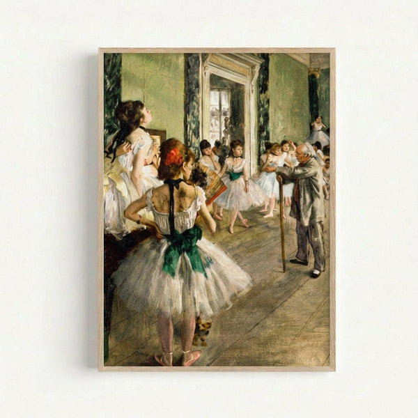 Framed reproduction of an Impressionist painting showing ballet dancers in white tutus with green sashes practicing in an ornate studio. The scene depicts young ballerinas stretching and positioning themselves while an elderly instructor in gray observes. The room features sage green walls with decorative molding, a large mirror, and wooden floors. The artwork is displayed in a light wooden frame against a white wall, showcasing the soft, muted color palette and loose brushwork characteristic of