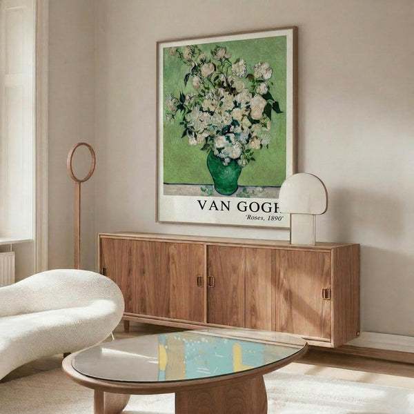 May include: Van Gogh roses poster print in thin wooden frame hanging above mid-century walnut credenza in modern living room. White roses in green vase against lime green background. Room features cream upholstered swivel chair, brass floor lamp, oval glass coffee table with colorful abstract art surface, white walls, and natural lighting from window.