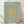 May include: Framed art print with sage green background featuring yellow organic cutout shape resembling coral or seaweed. Text reads "MATISSE THE CUT-OUTS" at top and "HENRI MATISSE, NICE, 1947" at bottom in golden lettering. Natural wood frame sits on light wooden floor against white textured wall with soft shadow patterns from window light.