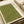 Japanese woodblock print with olive green background featuring three stylized bird silhouettes in darker green ink. Traditional calligraphy characters appear in the upper right corner on cream-colored paper with natural texture. The print is displayed in an open book or portfolio with beige pages, showing the artwork's placement within bound collection materials.