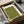 May include: Green textured print with Japanese calligraphy and minimalist bird silhouettes, displayed in black frame within cardboard shipping box surrounded by protective tissue paper and wooden dowels, showing unboxing presentation on white surface