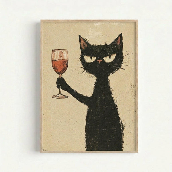 A framed art print showing a black cat with yellow eyes holding up a wine glass filled with red wine. The cat has a mischievous expression with visible fangs and pink inner ears. The artwork has a textured, sketchy style on a cream-colored background with small speckles. The print is displayed in a light wood frame against a white wall.
