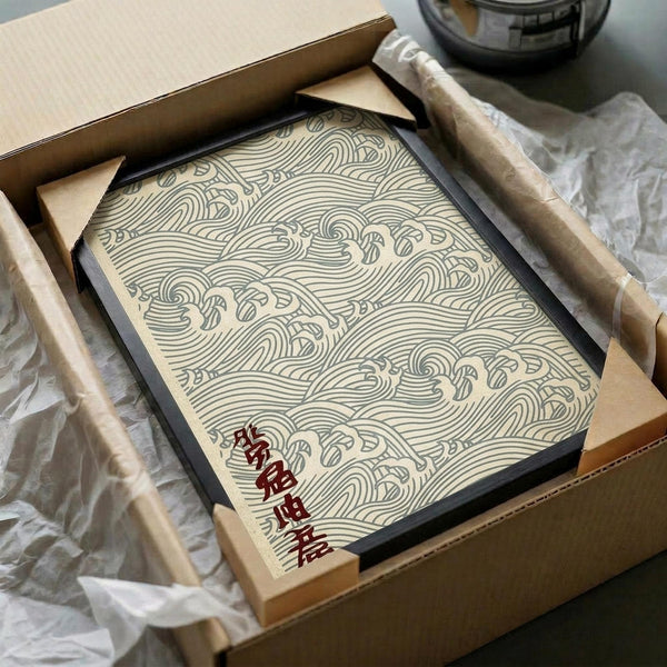 May include: Framed Japanese wave pattern artwork in cream and teal colors featuring flowing curved lines and traditional seigaiha design, displayed in black frame within cardboard packaging box with protective wrapping materials and wooden handles visible