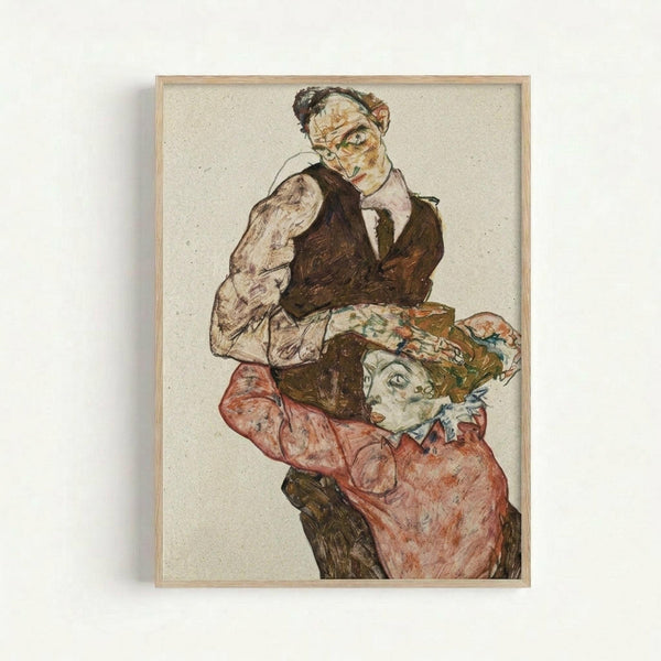 Framed reproduction of an early 20th century expressionist drawing showing two figures in an embrace. The artwork features bold outlines and muted colors - earth tones, reds, and greens. The upper figure wears dark clothing while the lower figure is dressed in reddish-pink garments. Both faces are rendered in the characteristic angular, emotional style of Austrian expressionism. The drawing is displayed in a simple light wood frame against a white wall, with visible paper texture and sketchy, ge
