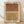 May include: Framed abstract art print featuring two overlapping arch designs with concentric line patterns. Top arch in terracotta orange, bottom arch in mustard yellow, both on cream background. Light wood frame displayed on wooden floor against white wall with natural lighting and soft shadows.