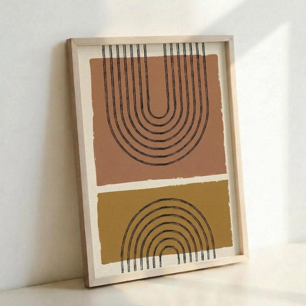 May include: Framed abstract art print leaning against white wall, featuring two geometric rainbow arches in black line art on color-blocked background - upper arch has vertical lines extending upward on terracotta orange section, lower arch curves downward on mustard yellow section, displayed in light wood frame