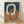 May include: Framed abstract art print featuring interlocking oval rings in cream, terracotta orange, and navy blue against a textured background. The wooden frame sits on light wood flooring against a white wall with natural shadows, showing the artwork's scale and modern minimalist style.