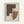 Abstract geometric artwork with overlapping shapes in earthy brown, cream, and rust tones. Features dotted stippling pattern throughout various organic forms including curved and angular elements. Displayed in light wood frame against white wall background in minimalist setting.