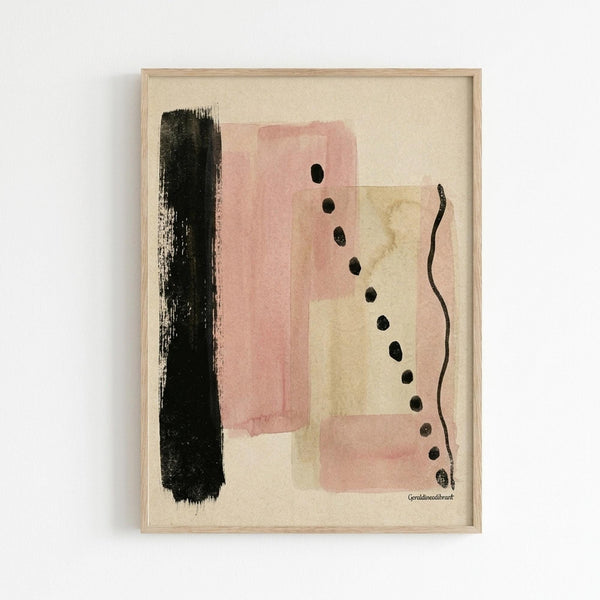 Framed abstract art print featuring soft pink and beige watercolor rectangles on cream paper, with a bold black brushstroke on the left, vertical row of black dots through the center, and curved black line on the right. The artwork is displayed in a natural wood frame against a white wall, with the artist's signature visible in the bottom right corner.
