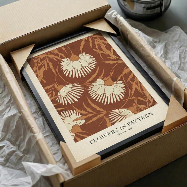 May include: Vintage-style botanical poster with cream and rust brown floral pattern featuring stylized flowers and leaves, displayed in black frame inside cardboard shipping box with protective tissue paper and wooden dowel tubes for packaging