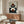 May include: Modern geometric abstract art print displayed above a walnut sideboard in a minimalist living room. The poster features overlapping circles and semicircles in terracotta, navy blue, cream, and brown tones on a light background within a thin wooden frame. A white curved chair and round glass coffee table complete the mid-century modern styling.