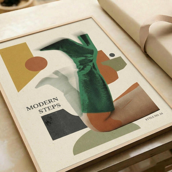 May include: Abstract geometric poster print in wooden frame featuring overlapping organic shapes in green, terracotta orange, olive, mustard yellow, gray and black. Modern minimalist artwork displayed on light wood surface with neutral wrapping paper rolls nearby. Clean contemporary styling with earth tone color palette and flowing curved forms mixed with angular geometric elements.