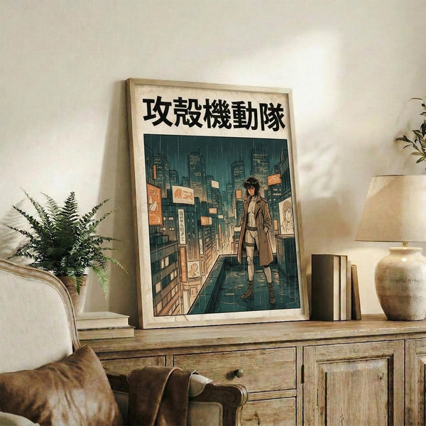 May include: Framed anime-style poster featuring a character in a brown coat standing on a futuristic city street with tall buildings and glowing signs, displayed on a rustic wooden console table alongside books, a ceramic vase, and fern plant in a cozy living room setting with beige armchair