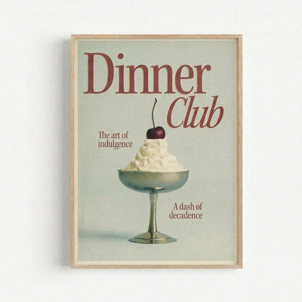 Framed vintage-style poster with light wooden frame displaying an ice cream sundae in a metal pedestal dish topped with whipped cream and cherry. Features red text reading "Dinner Club" and "The art of indulgence" and "A dash of decadence" on pale mint green background. Clean retro design with classic dessert illustration mounted on white wall.