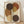 May include: Framed abstract art print featuring overlapping circles in earthy brown, rust, golden yellow and cream tones with black polka dot pattern running vertically through center, displayed in light wood frame leaning against white wall on wooden floor with natural window light creating soft shadows