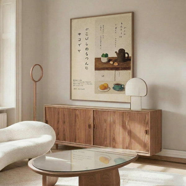 May include: Japanese calligraphy poster with kitchen still life illustrations hung above wooden sideboard in modern living room. Cream-colored print features black Japanese text, teapot, cups, and food items in minimalist style. White sculptural chair and glass coffee table visible in foreground with natural lighting creating shadows across walnut furniture.