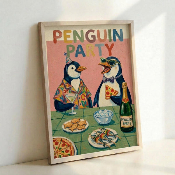 May include: Framed poster print leaning against white wall showing two cartoon penguins celebrating at a party table. One penguin wears a colorful Hawaiian shirt and party hat holding a martini, the other wears sunglasses and bow tie holding pizza slice. Table displays pizza, fish, crackers, ice bowl, and champagne bottle labeled "Penguin Party." Pink background with rainbow "PENGUIN PARTY" text at top. Light wood frame, vibrant retro illustration style.